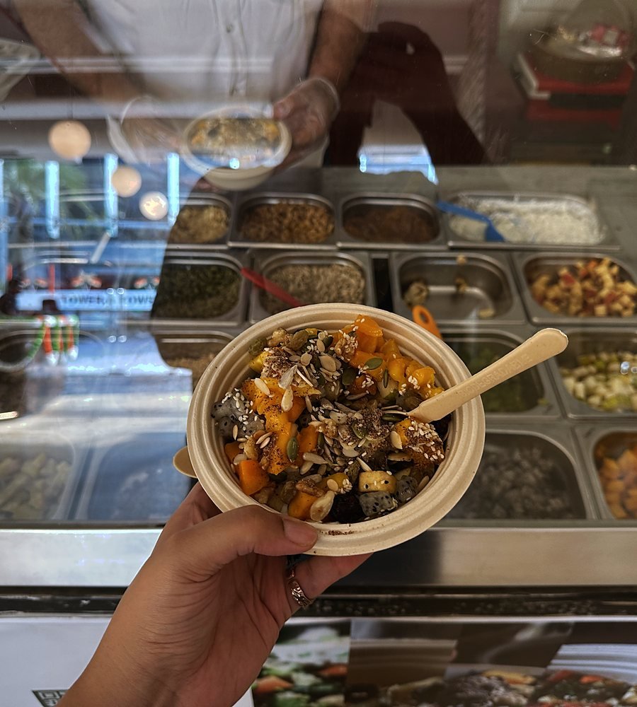 A finished Bowlsome® bowl held in front of the live counter